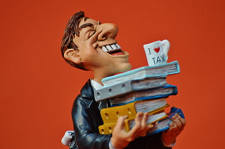 laughing man holding books figurine thumbnail