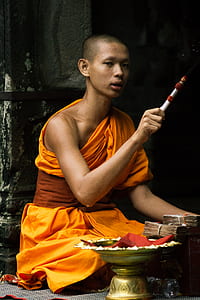 man wearing orange top thumbnail