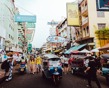 blue and red auto rickshaw on road thumbnail