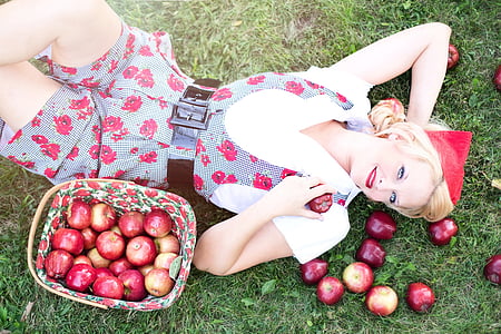 woman lying down with bunch of apples thumbnail