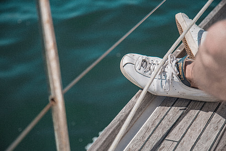 selective focus photography of sitting near body of water thumbnail