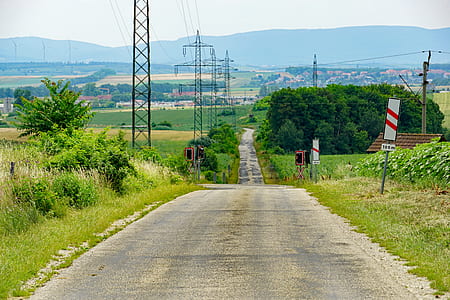 gray concrete road during daytime thumbnail