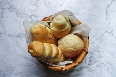 Four Brown Pastries in Brown Wicker Basket thumbnail