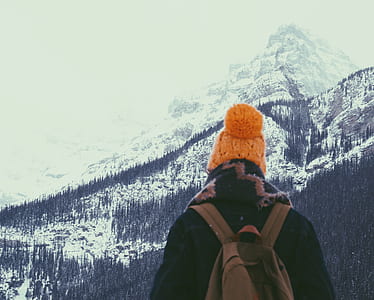 person standing near snow-covered mountain thumbnail