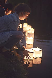 woman holding paper lamp thumbnail