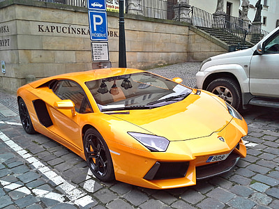 yellow Ferrari car parked on road thumbnail