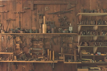 brown wooden handled tool lot on brown wooden shelf thumbnail