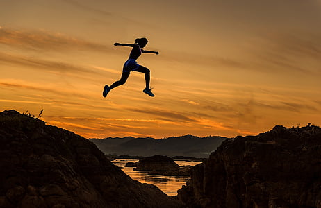 silhouette of woman jump on the rock thumbnail
