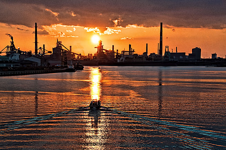 landscape photograph of boat sailing thru sea thumbnail