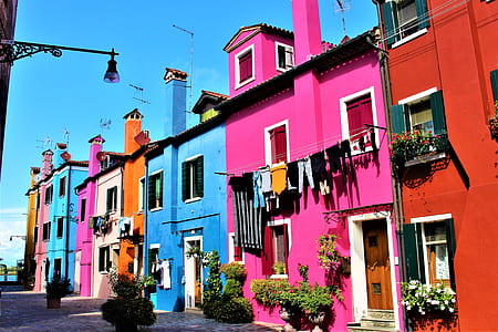 pink, orange, blue, and white houses thumbnail