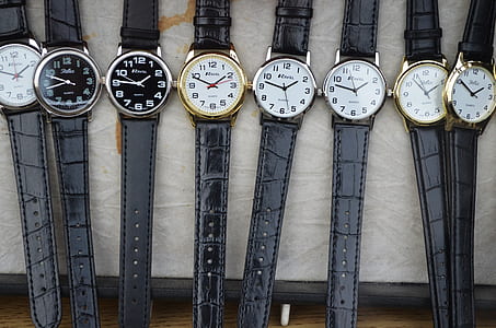 pile of round white and black analog watches thumbnail