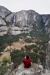 man sitting on cliff thumbnail