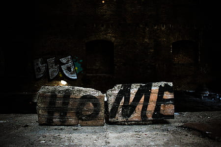 black HOME painted on gray concrete bricks thumbnail