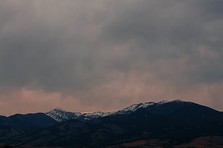 black and white mountain under gray cloudy sky at daytime thumbnail