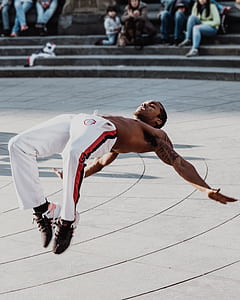 man doing tricks in front of people on park thumbnail
