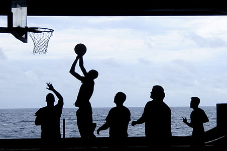 silhouette of people playing basketball at daytime thumbnail