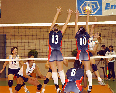 two volleyball players blocking spike thumbnail