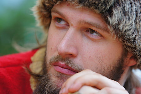 shallow focus photography of man in red and brown top thumbnail