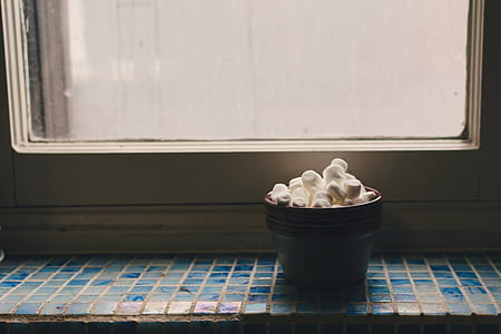 marshmallow inside black bowl thumbnail