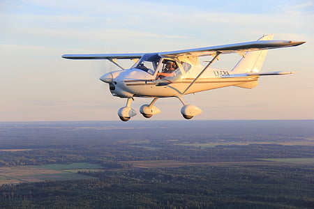 man riding white bi-plane during daytime thumbnail