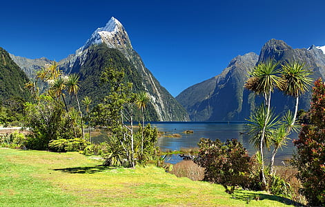 mountains and lake during daytime thumbnail