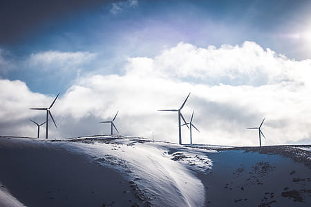 windmill under snow during daytime thumbnail