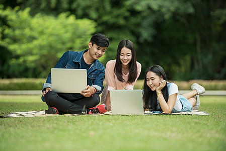 shallow focus photography of man and two woman thumbnail