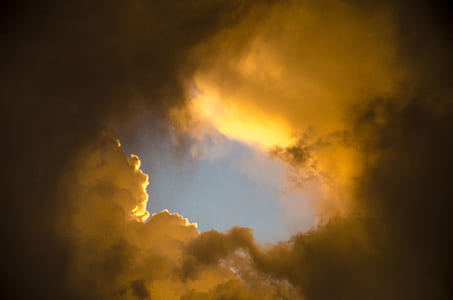low-angle photography of white clouds at golden hour thumbnail