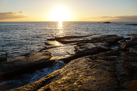 rock formation near body of water thumbnail