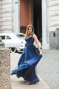 woman wearing blue floral sleeveless dress thumbnail