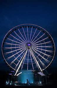 white Ferris wheel near water fountain thumbnail