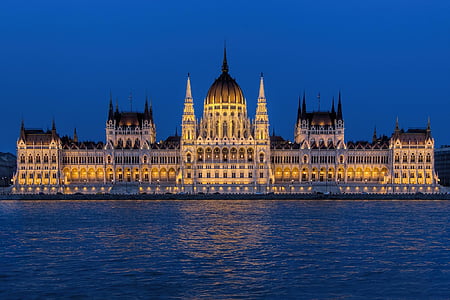 white and brown concrete building with distance to body of water thumbnail