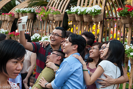 people gathering outdoor taking photo thumbnail