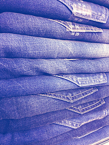 pile of blue denim jeans thumbnail