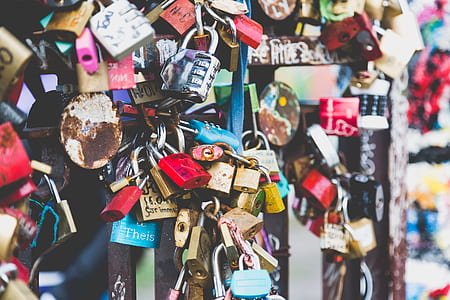 assorted padlock mounted on black steel frame thumbnail