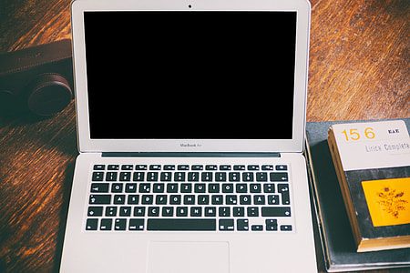 MacBook Air, camera and books thumbnail