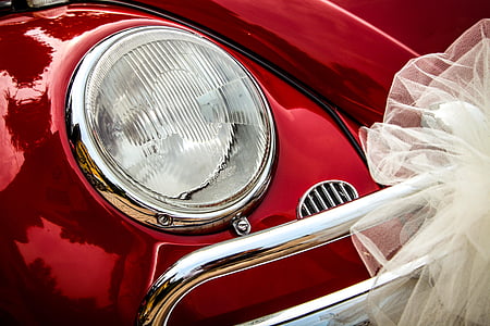 shallow focus of silver car headlight thumbnail