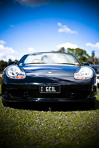 black Porsche on grass field thumbnail