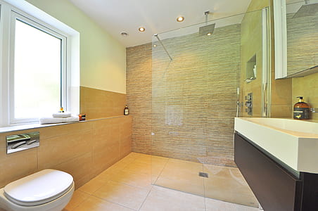 white ceramic water closet beside window thumbnail