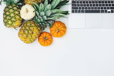 fruits near laptop on desk thumbnail