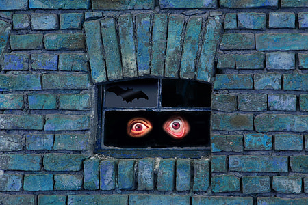 black tinted glass window with 3D human eye sticker thumbnail