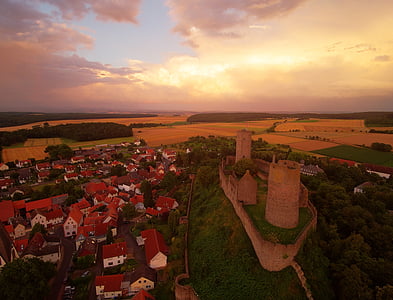aerial photo of castle under cloudy sky thumbnail