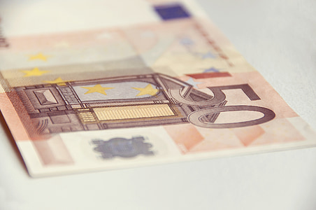 selective focus photography of 50 Euro banknote on gray surface thumbnail