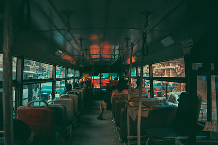 group of people sitting inside bus thumbnail