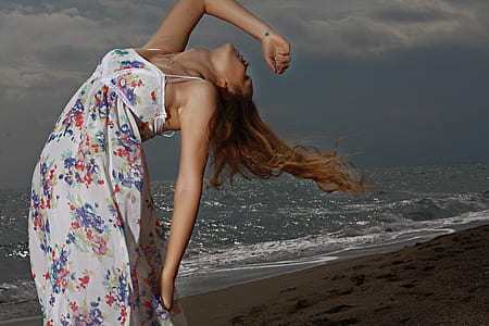woman standing on seashore thumbnail