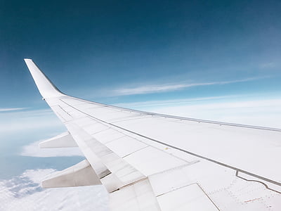 passenger's view of white airplane wing thumbnail