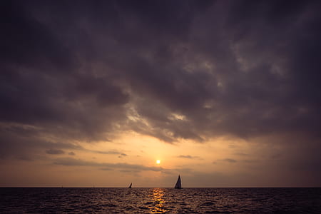 two sail boats sailing on the sea thumbnail