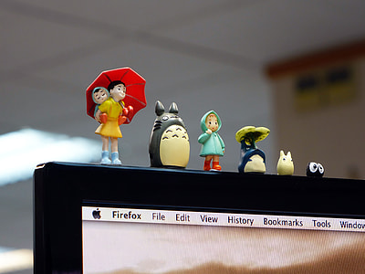 children's assorted plastic toys on top of black flat screen TV thumbnail