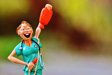 nurse holding red hot water bottle figurine thumbnail
