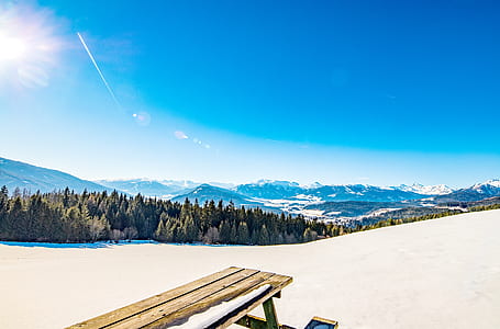 brown wooden bench chair on white sand thumbnail